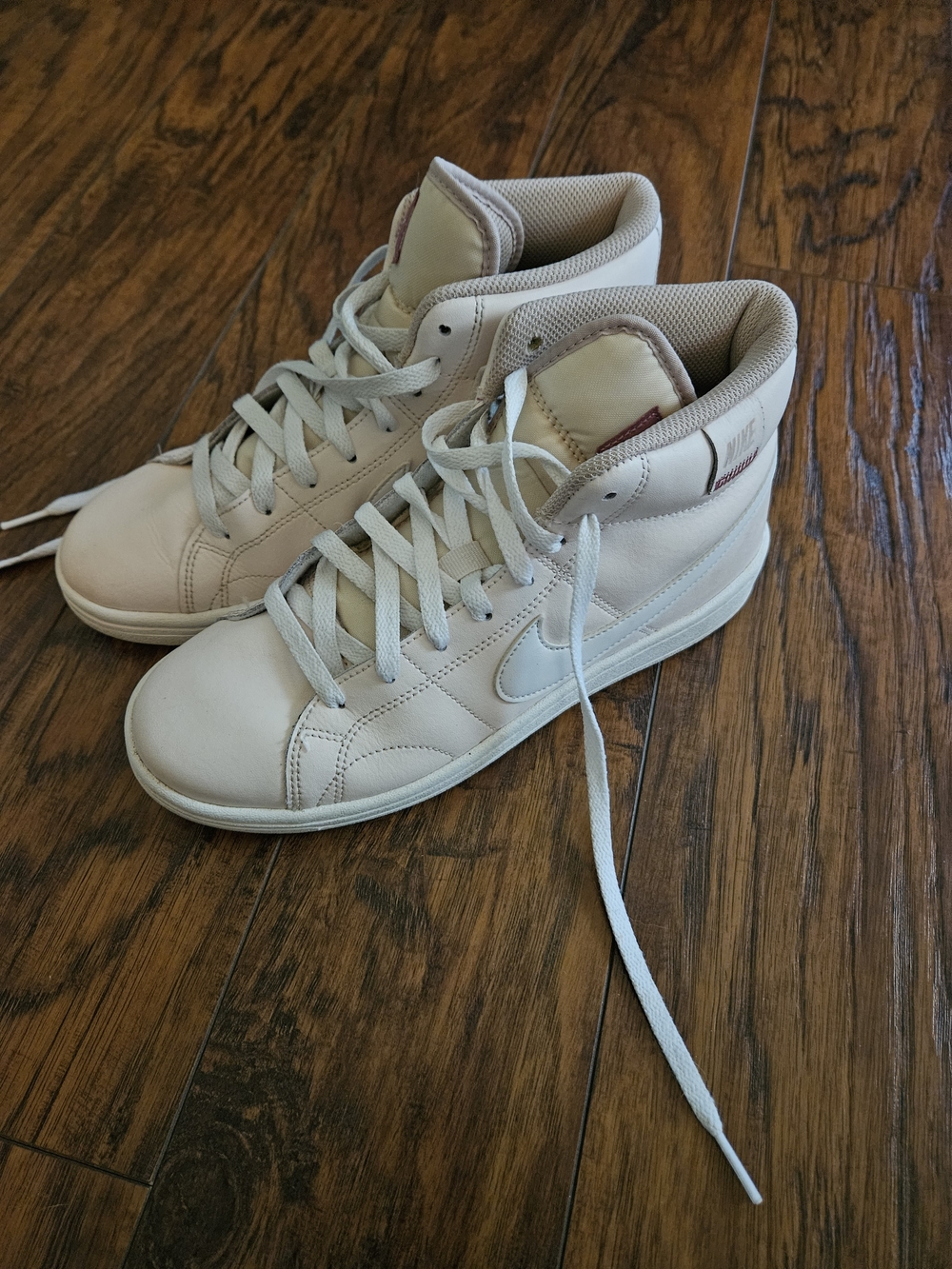 Light Pink High-Top Sneakers with Swoosh Detail